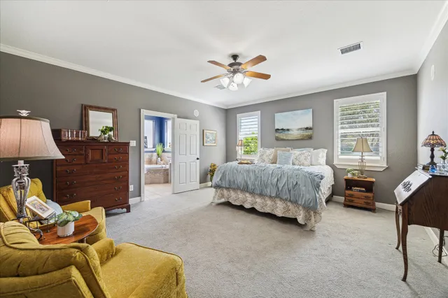 a bedroom with a bed couch and window