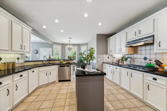 a kitchen with sink cabinets and window