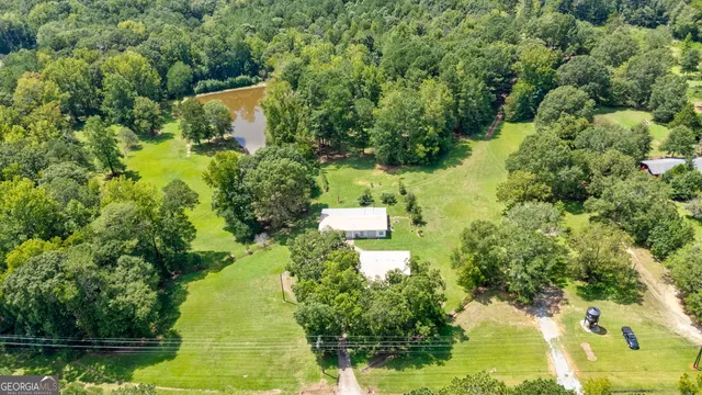 a aerial view of a house with a yard