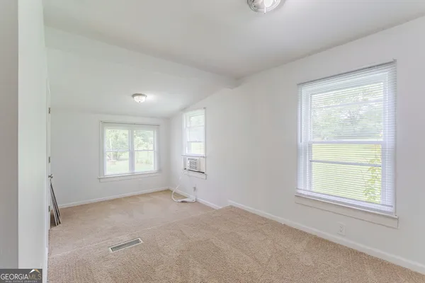 an empty room with windows