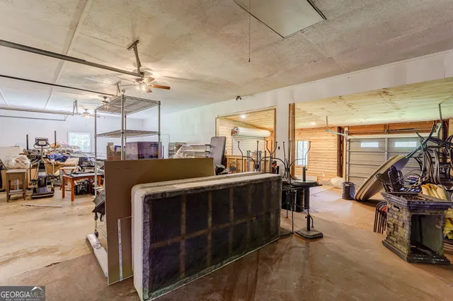 a view of a yard with plants and trees