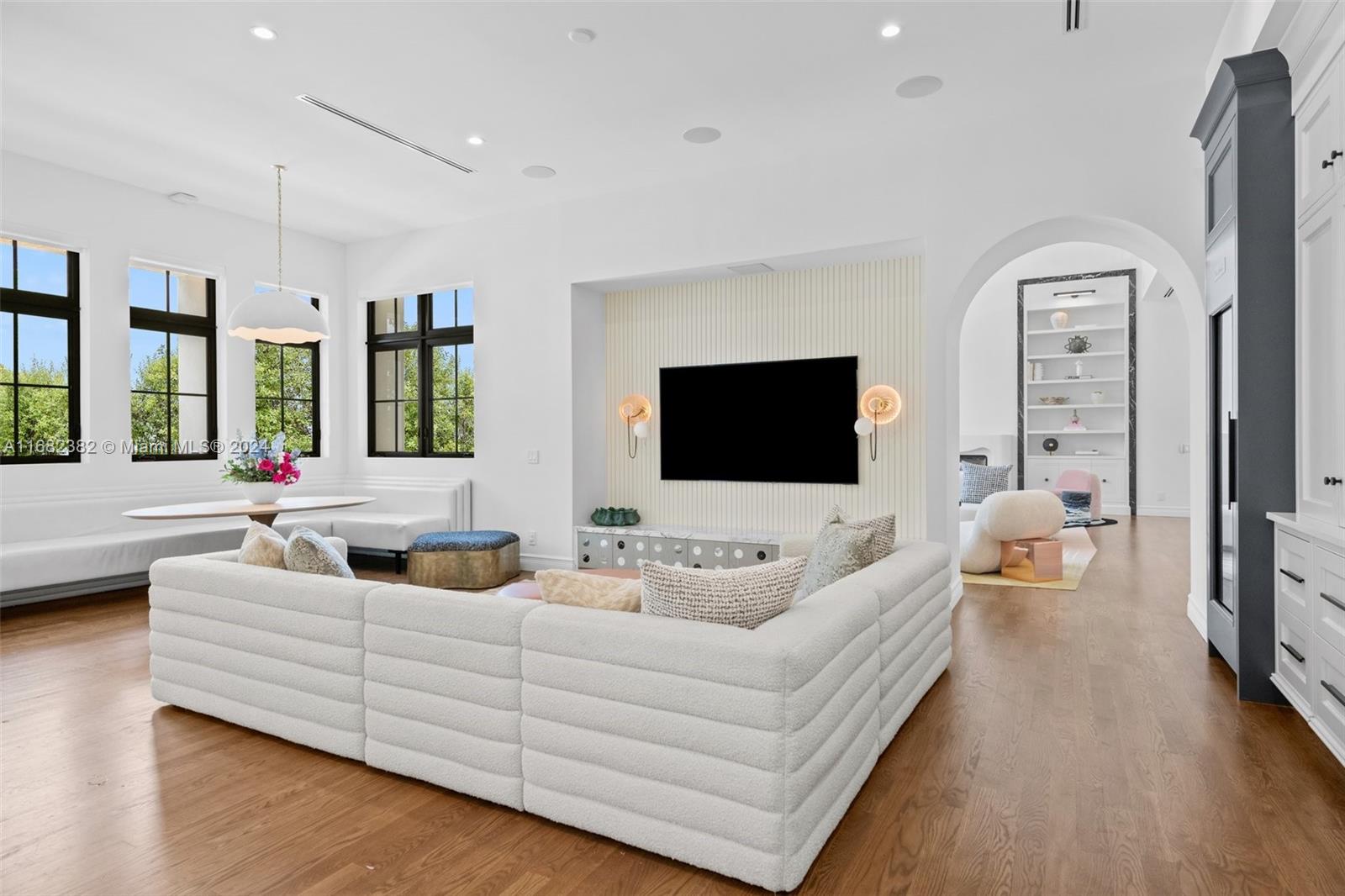 406 Tamarind Drive Hallandale Beach, FL 33009 - Photo 11 of 37 a living room with furniture wooden floor and a flat screen tv