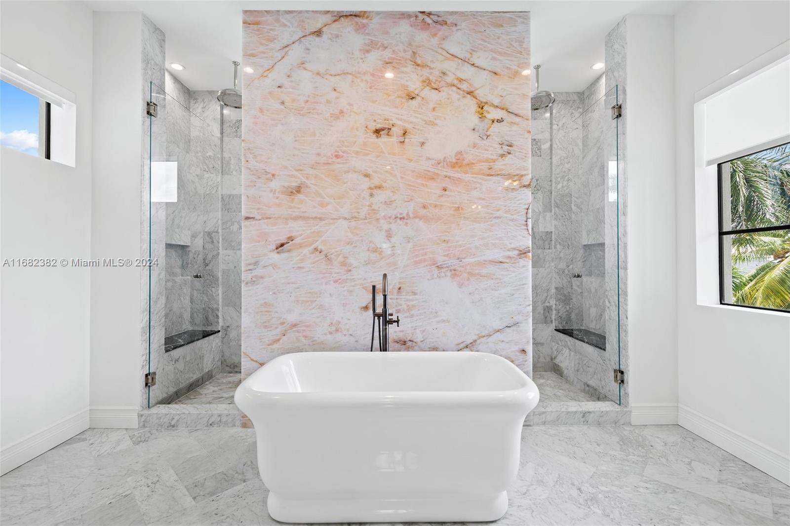 406 Tamarind Drive Hallandale Beach, FL 33009 - Photo 24 of 37 a bathroom with a bathtub and shower