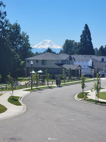 a swimming pool with outdoor seating and yard