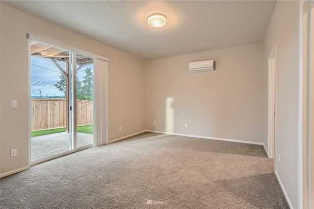 an empty room with sliding door