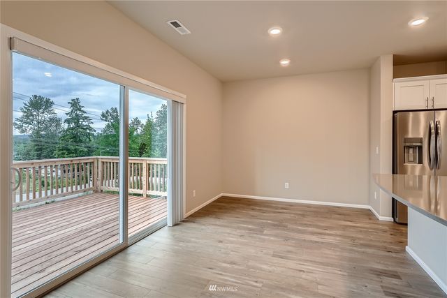 a view of entryway with wooden floor