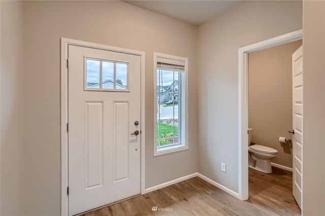 a view of a room that has a bed and a window in it