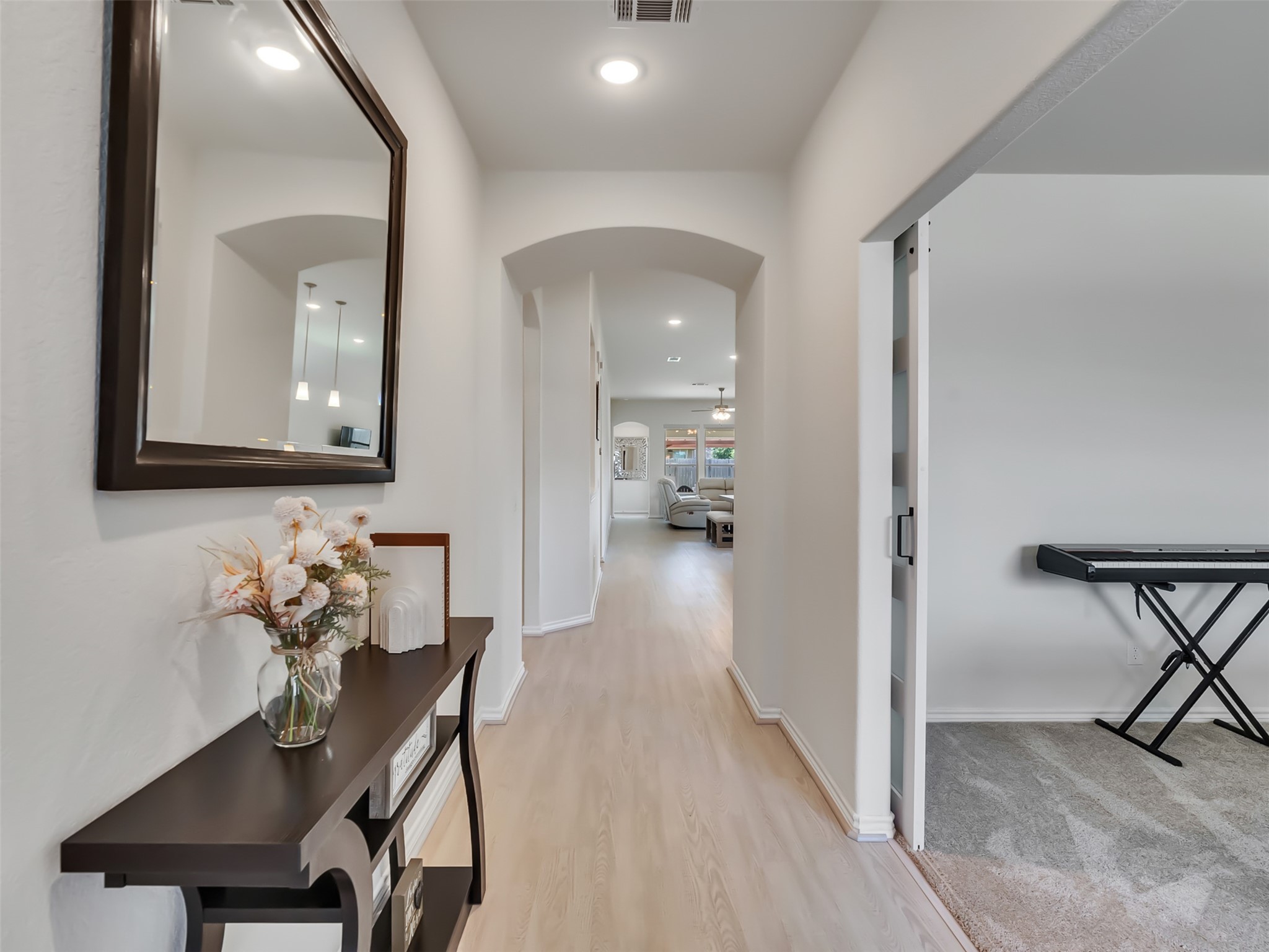 27997 Lone Hollow Lane Spring, TX 77386 - Photo 14 of 45 a view of a hallway with furniture and a livingroom view