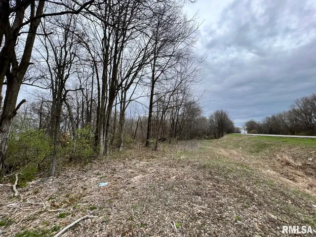 a street sign sitting on top of a wall