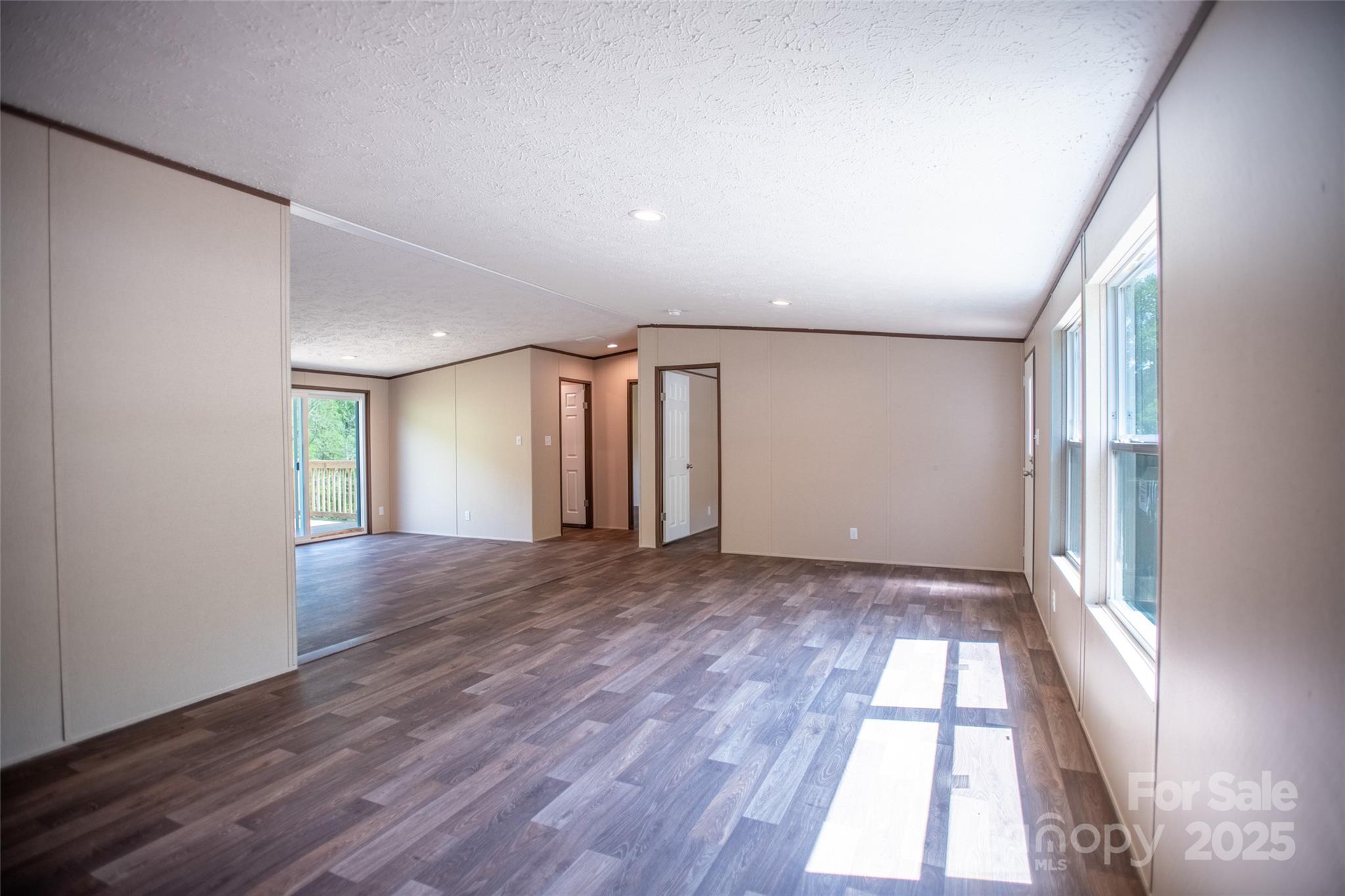 1455 Newfound Road Leicester, NC 28748 - Photo 13 of 47 wooden floor in an empty room with a window