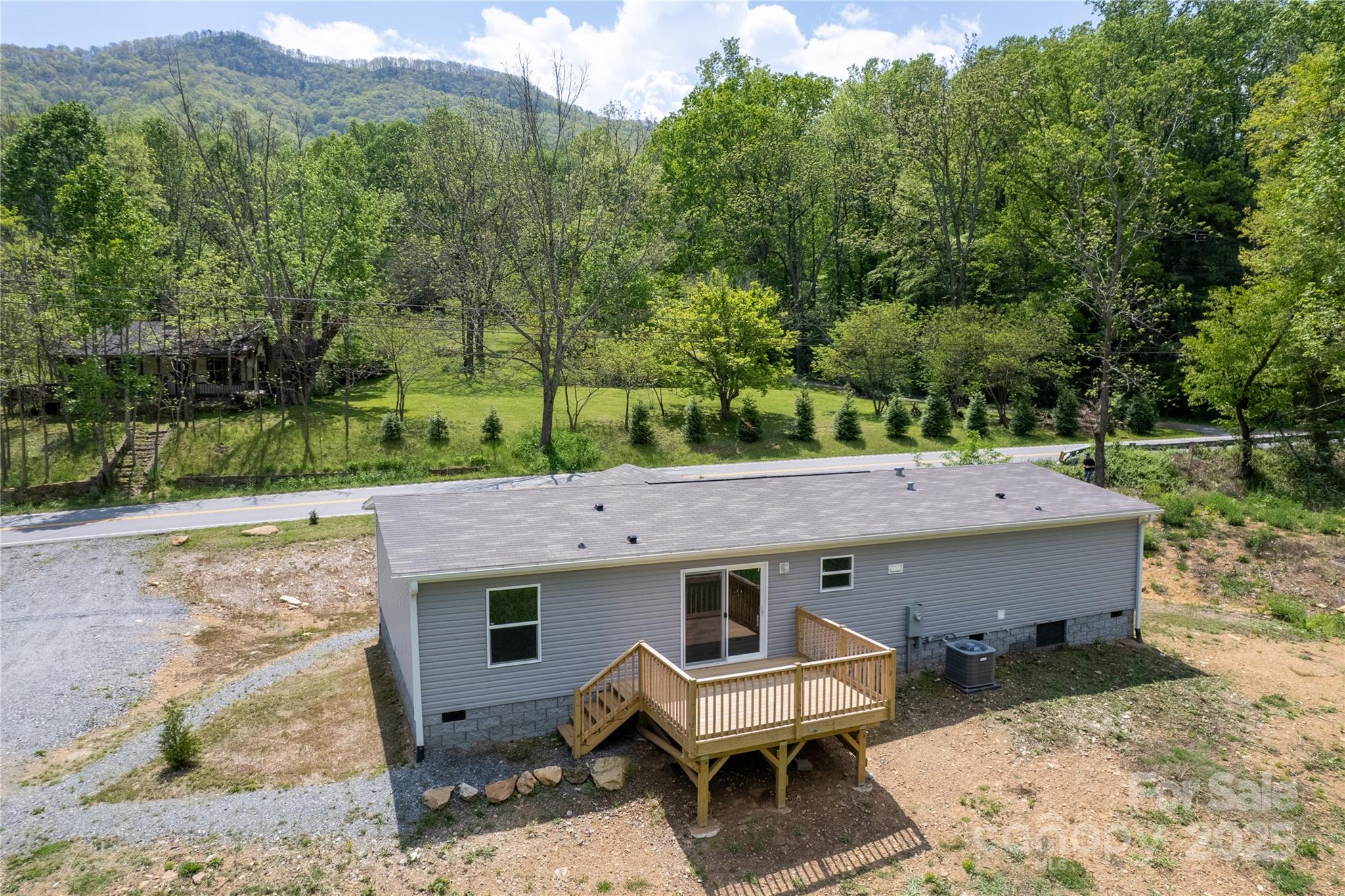 1455 Newfound Road Leicester, NC 28748 - Photo 2 of 47 an aerial view of a house with a yard