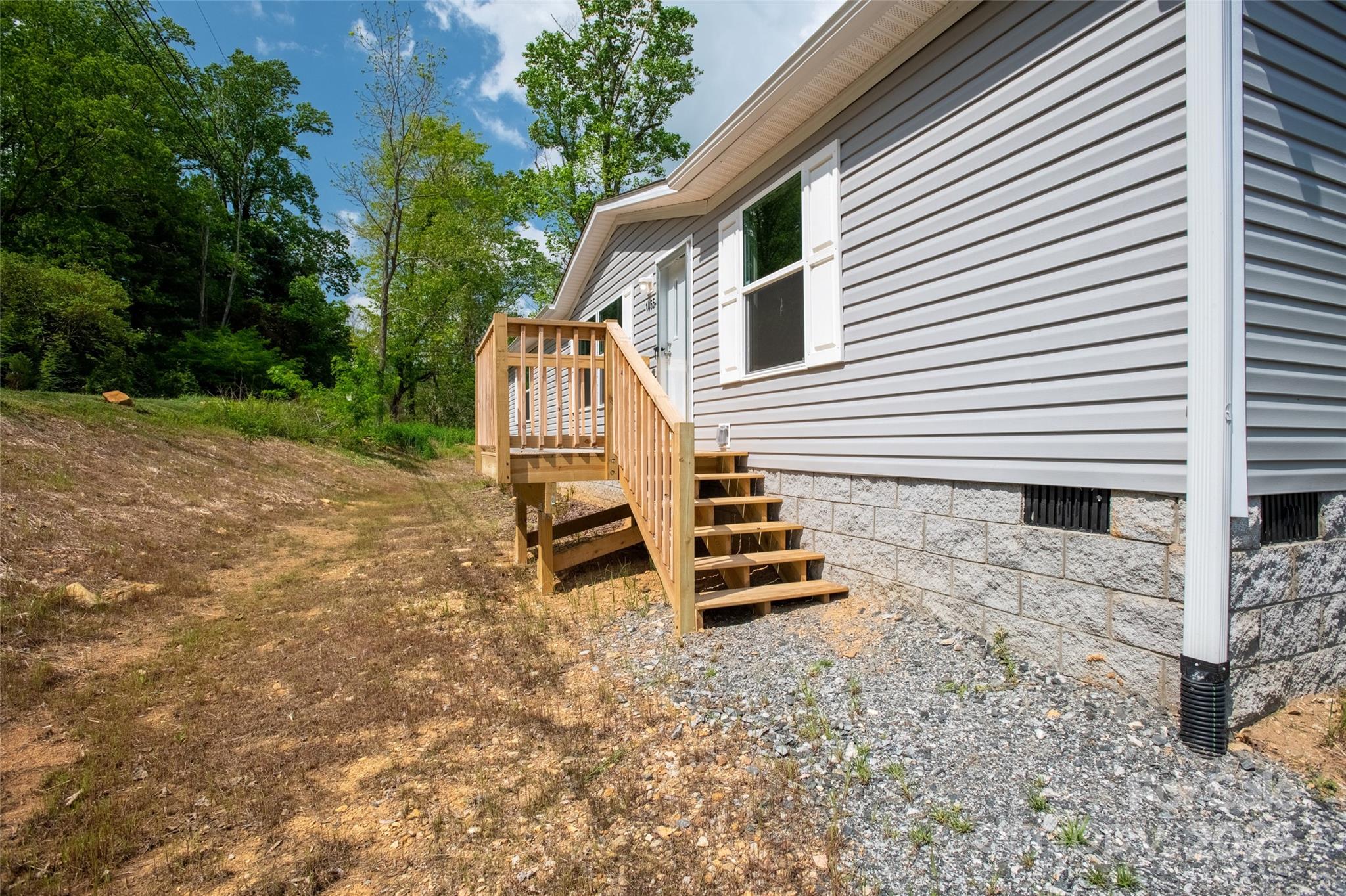1455 Newfound Road Leicester, NC 28748 - Photo 34 of 47 a view of a house with backyard and wooden fence