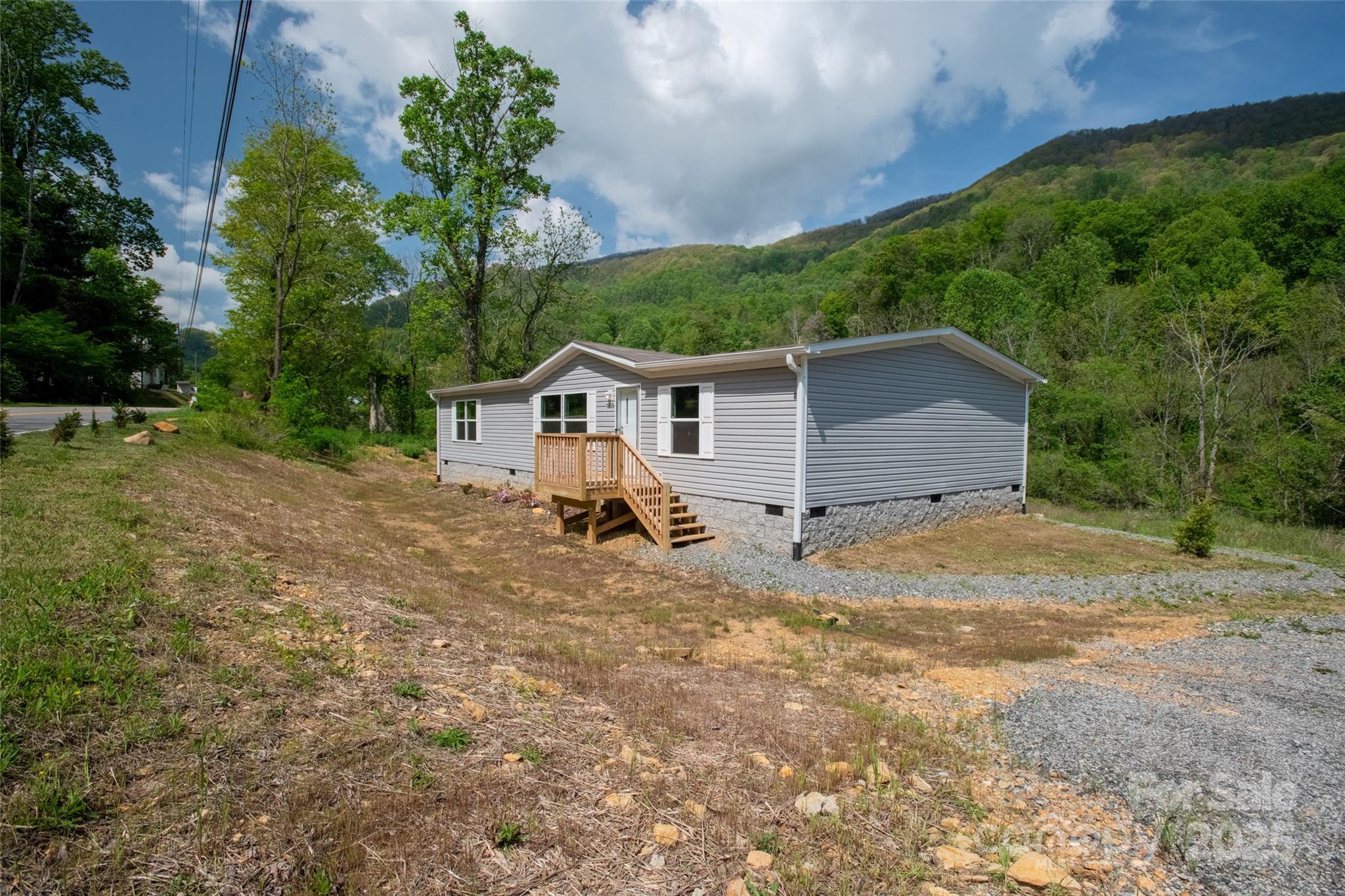 1455 Newfound Road Leicester, NC 28748 - Photo 38 of 47 a view of a house with a backyard