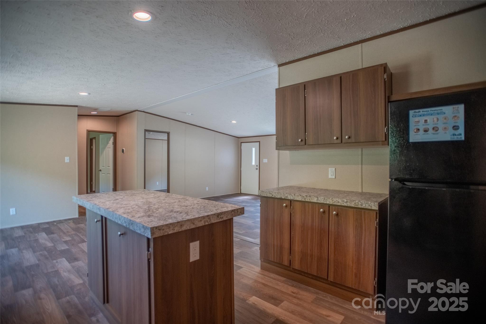 1455 Newfound Road Leicester, NC 28748 - Photo 8 of 47 a kitchen with a sink refrigerator and microwave