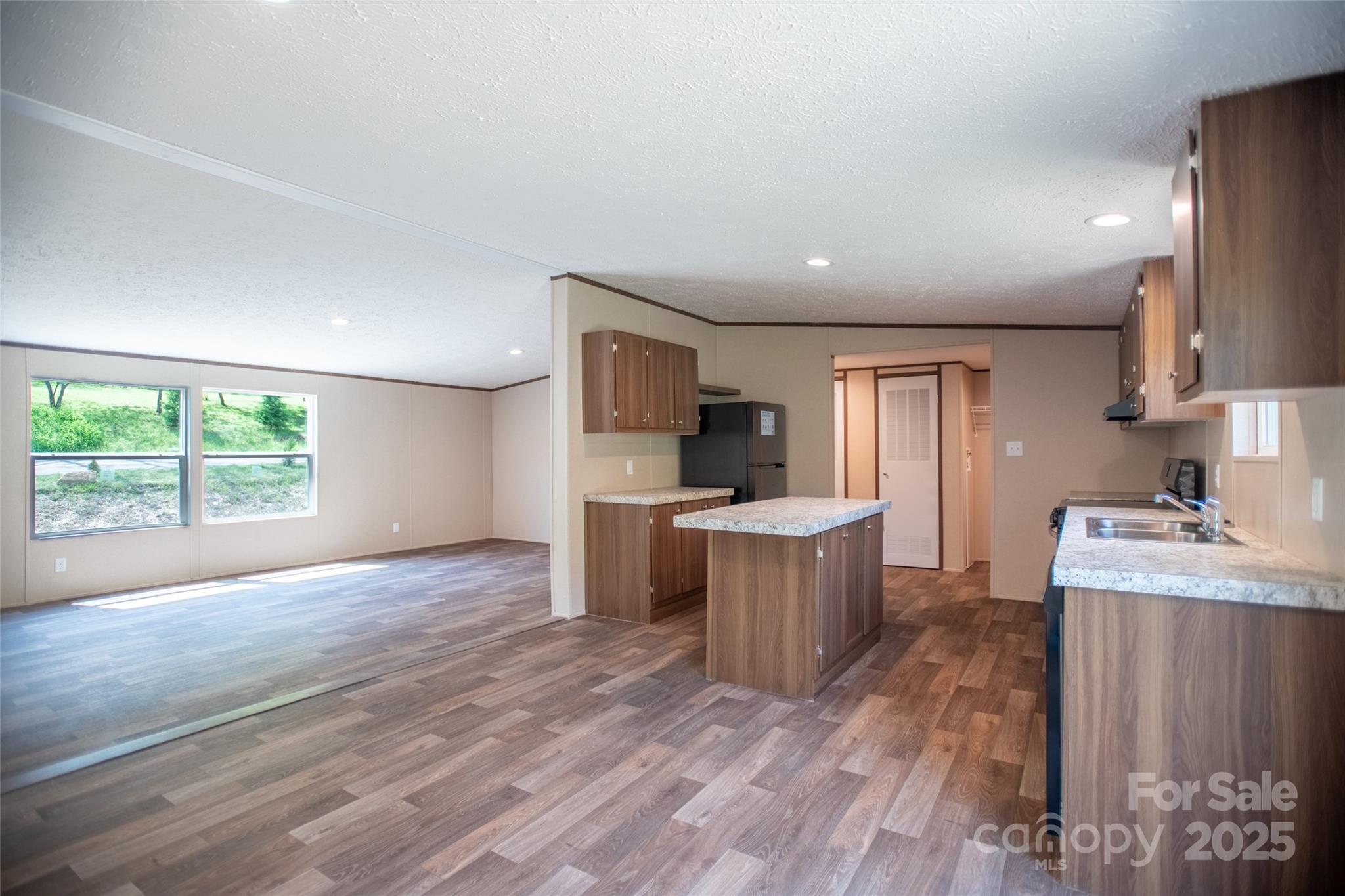 1455 Newfound Road Leicester, NC 28748 - Photo 10 of 47 a kitchen with a sink and wooden floor