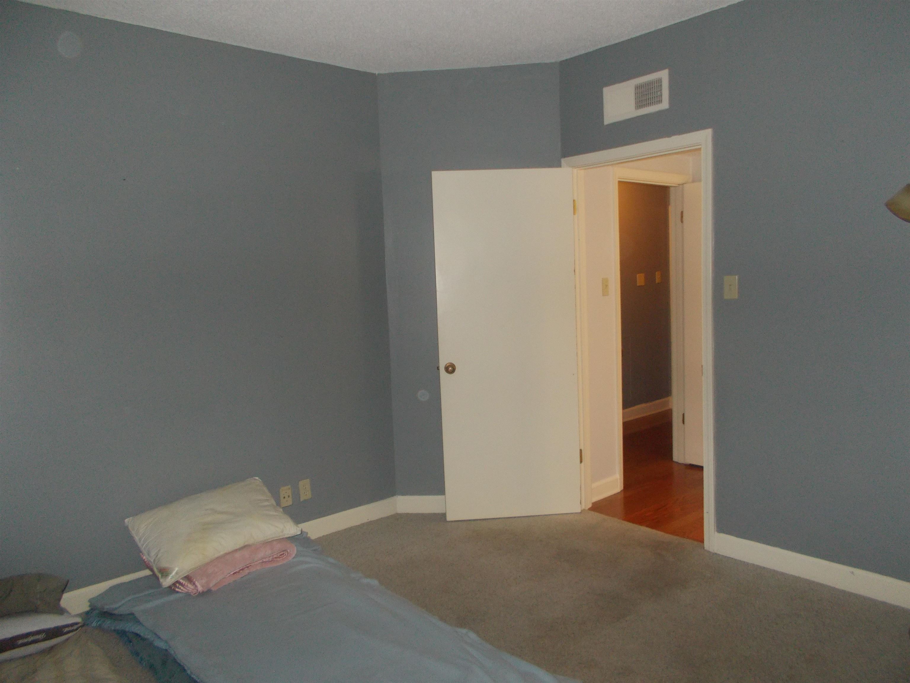 109 North Main Street, Unit 1207 Memphis, TN 38103 - Photo 12 of 25 Carpeted bedroom with baseboards