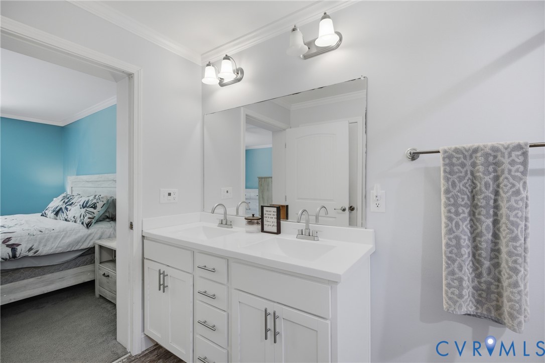 93 Faraway Road Saluda, VA 23149 - Photo 20 of 58 a en suite bathroom with a double vanity sink and a mirror