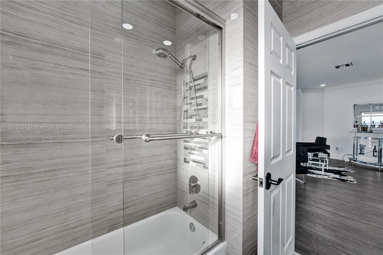 18831 Southwest 24th Street Miramar, FL 33029 - Photo 58 of 96 a bathroom with a tub and a shower