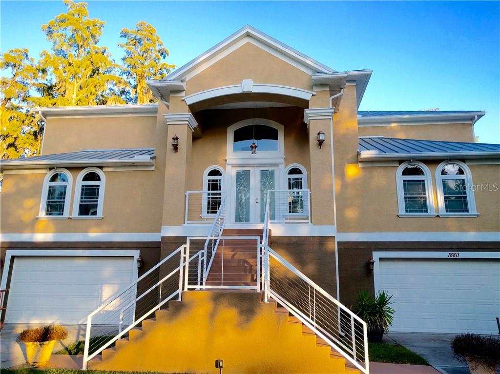LAKEFRONT HOME W/4 BEDROOMS, 4.5 BATH & 6 CAR GARAGE/ELEVATOR TO ALL FLOORS.