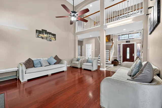 a living room with furniture and a painting