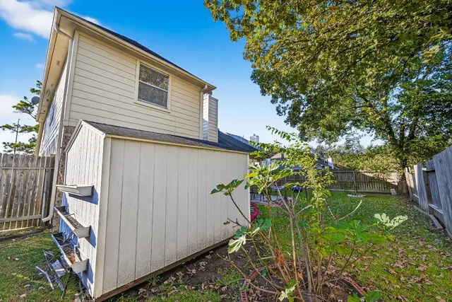a view of a house with backyard porch and sitting area