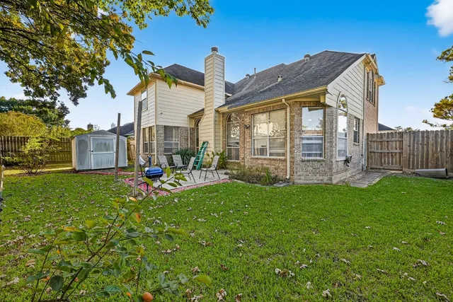 a view of backyard with sitting area
