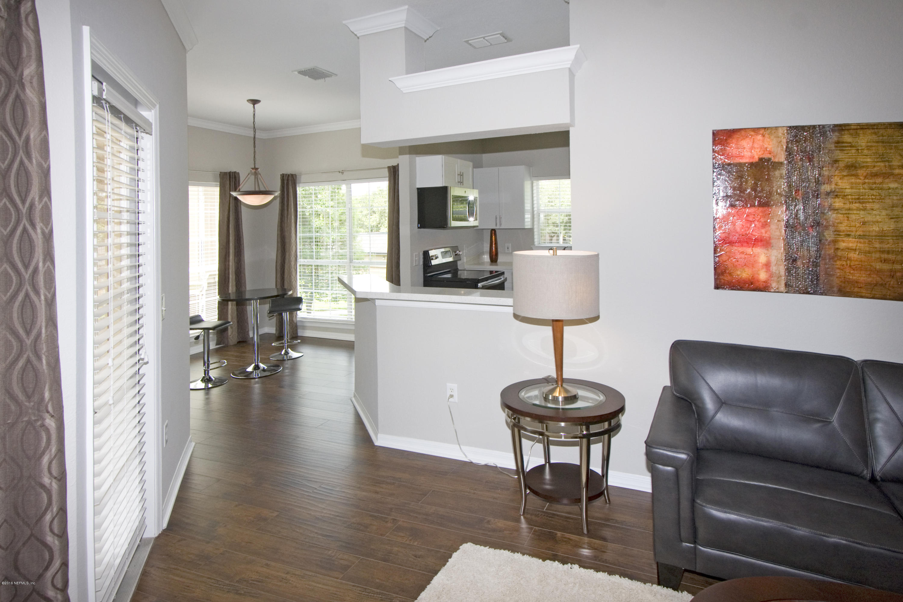 10961 Burnt Mill Road, Unit 222 Jacksonville, FL 32256 - Photo 7 of 20 a living room with furniture