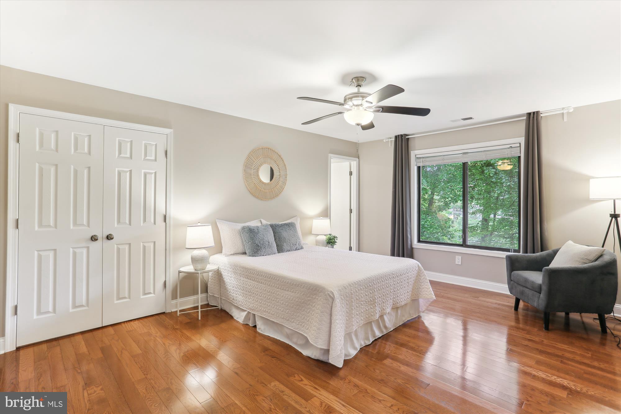 4 Eaglebrook Court Rockville, MD 20854 - Photo 36 of 83 a bedroom with a large bed and a chandelier
