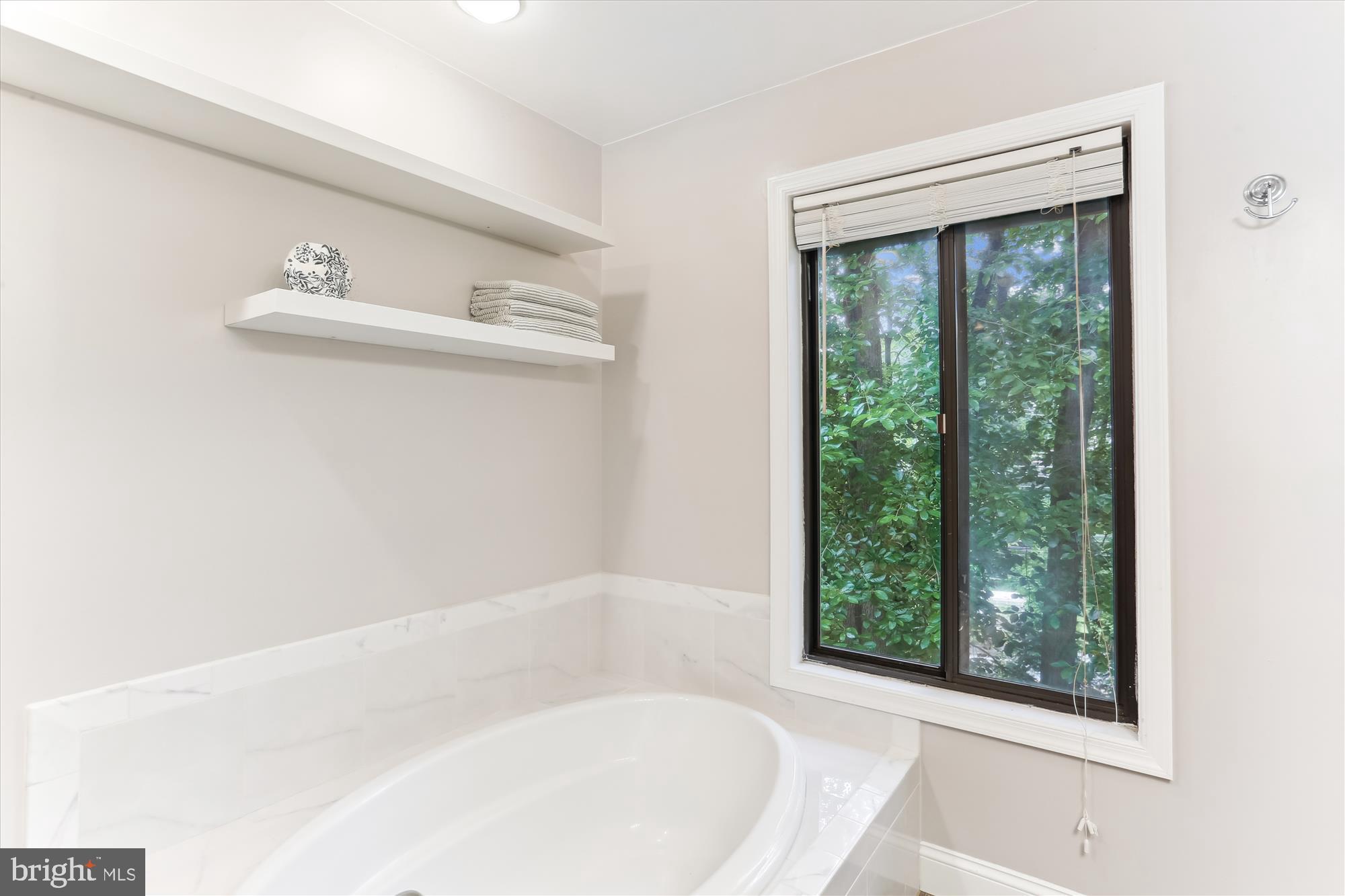 4 Eaglebrook Court Rockville, MD 20854 - Photo 41 of 83 a white bath tub sitting next to a window