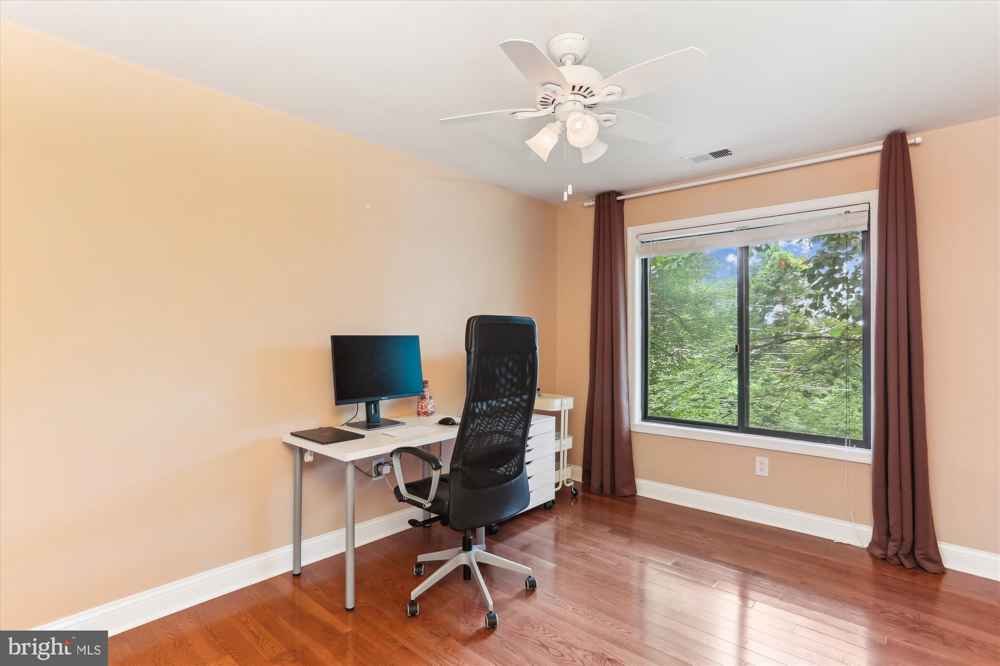4 Eaglebrook Court Rockville, MD 20854 - Photo 46 of 83 a view of a workspace with furniture and a window