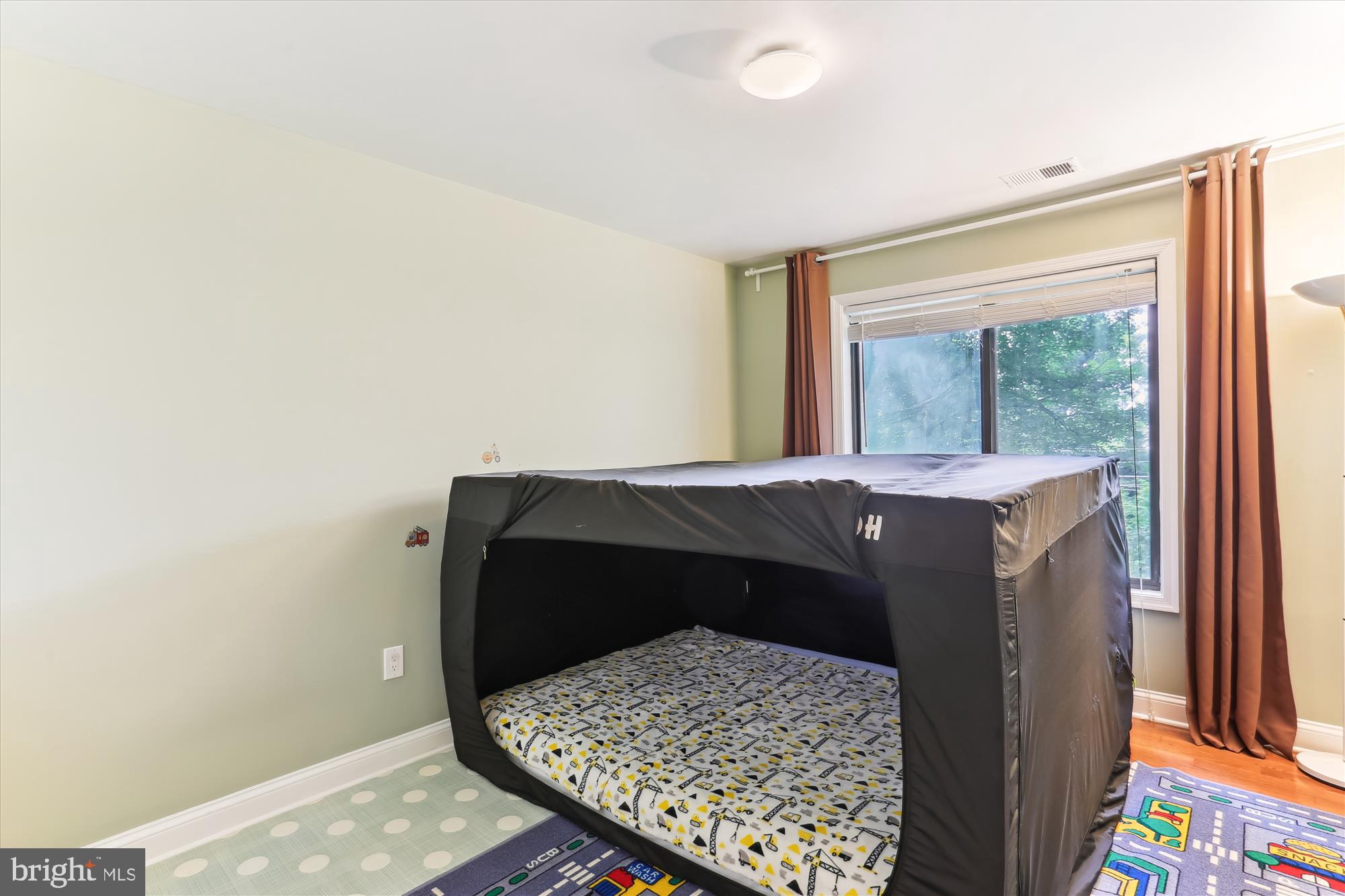 4 Eaglebrook Court Rockville, MD 20854 - Photo 50 of 83 a bed sitting in a bedroom next to a window