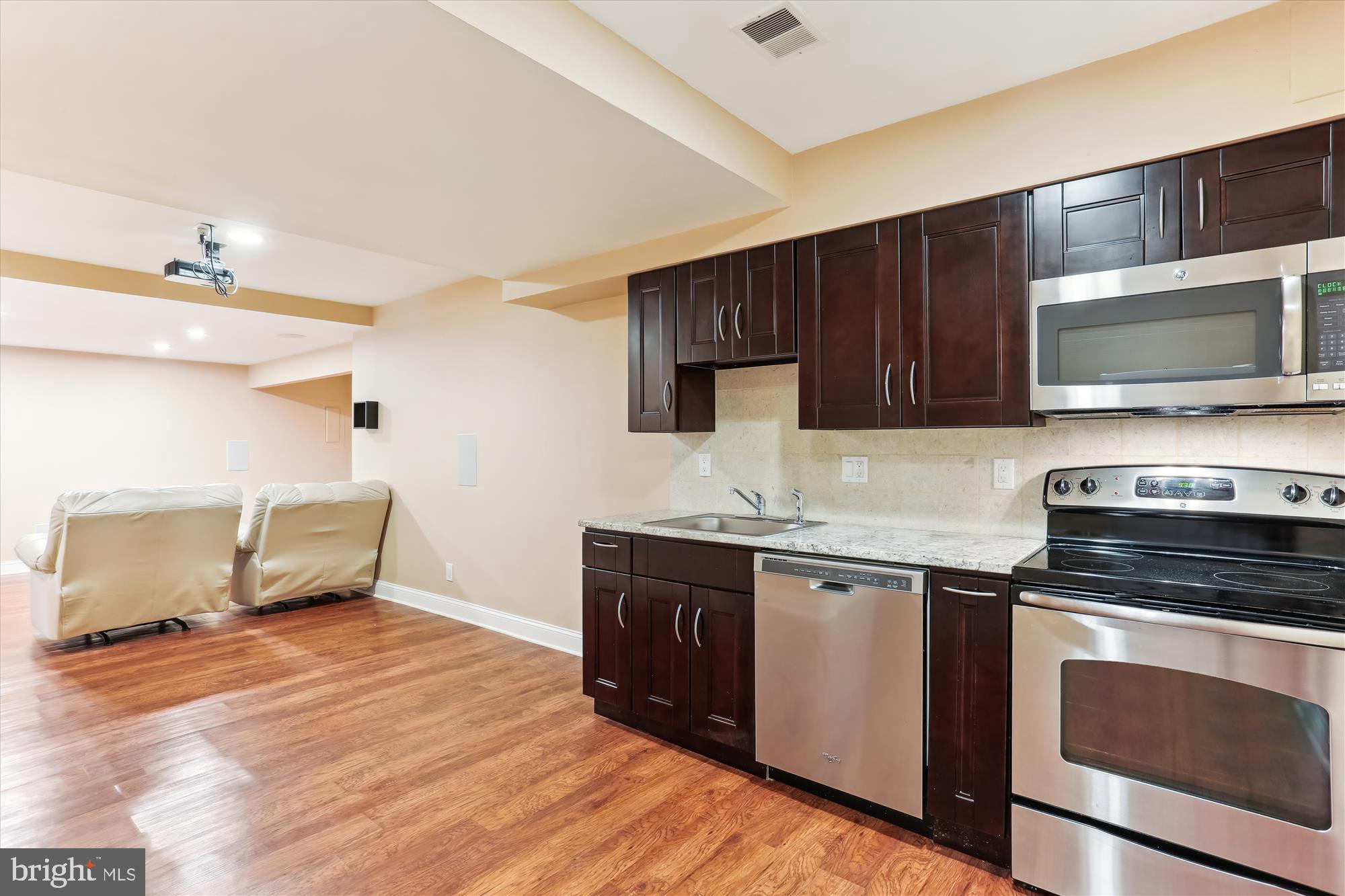 4 Eaglebrook Court Rockville, MD 20854 - Photo 54 of 83 a kitchen with stainless steel appliances granite countertop a stove a sink and a microwave
