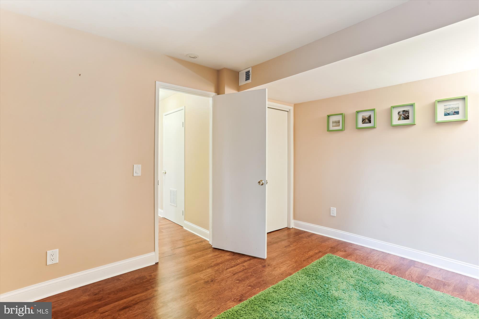 4 Eaglebrook Court Rockville, MD 20854 - Photo 63 of 83 a view of an empty room with wooden floor