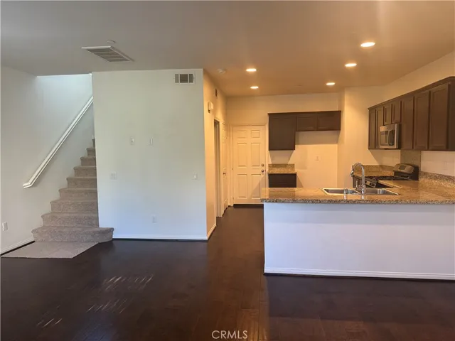 a view of kitchen with wooden floor