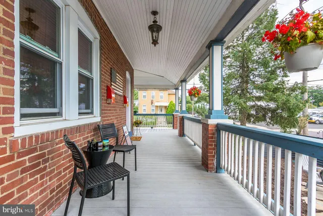 a brick building with a red door