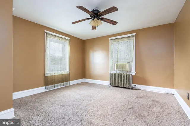 a kitchen with stainless steel appliances a stove a sink and cabinets