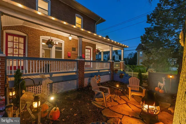 a outdoor space with patio couches and a potted plant on a table