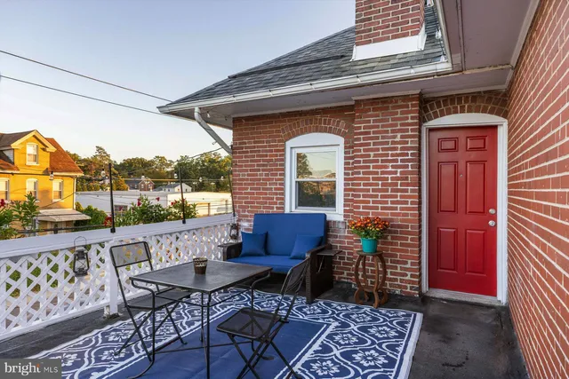 a view of a chairs and table in patio