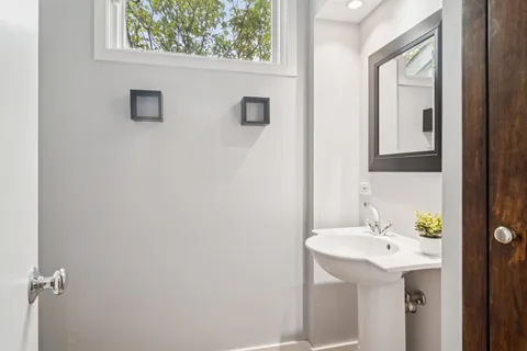 a bathroom with a sink and mirror