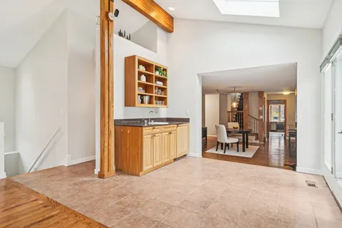 a view of a livingroom with furniture and a window