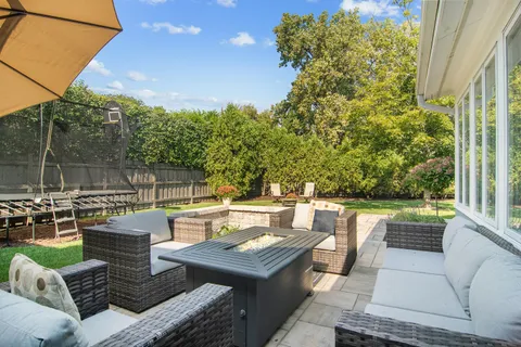 a view of a patio with couches chairs and a table and chairs