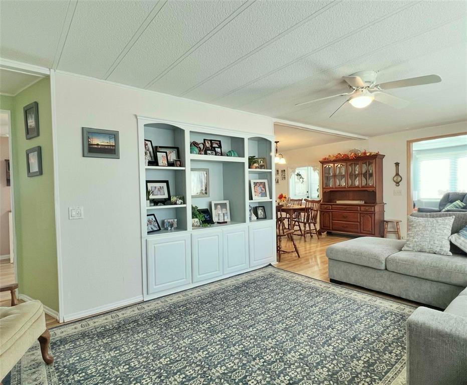 1100 South Belcher Road, Unit 604 Largo, FL 33771 - Photo 12 of 64 a living room with furniture and a flat screen tv