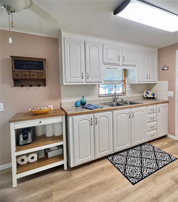 1100 South Belcher Road, Unit 604 Largo, FL 33771 - Photo 6 of 64 a kitchen with stainless steel appliances a stove a sink and cabinets