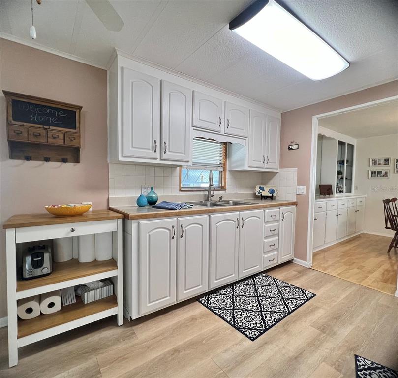 1100 South Belcher Road, Unit 604 Largo, FL 33771 - Photo 7 of 64 a kitchen with stainless steel appliances cabinets and window