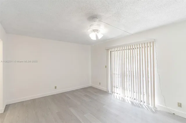 an empty room with a empty space and a window