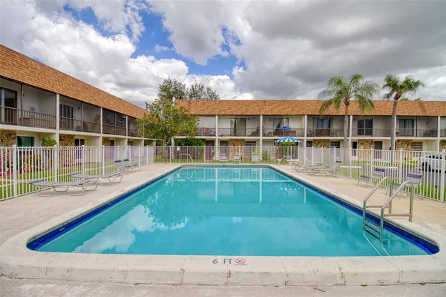 a view of a swimming pool with a patio