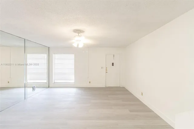 a view of an empty room with a window