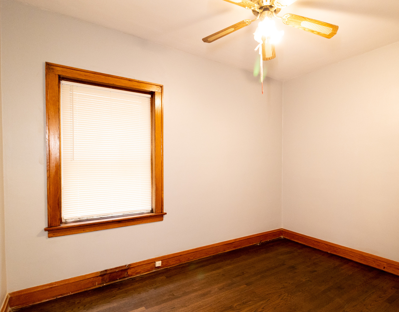 2115 Wesley Avenue, Unit 1 Berwyn, IL 60402 - Photo 6 of 8 a view of a small space with wooden floor and a window
