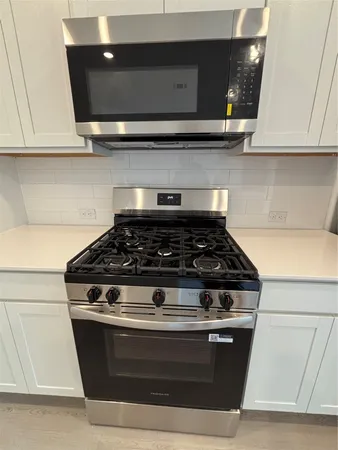 a utility room with washer and dryer
