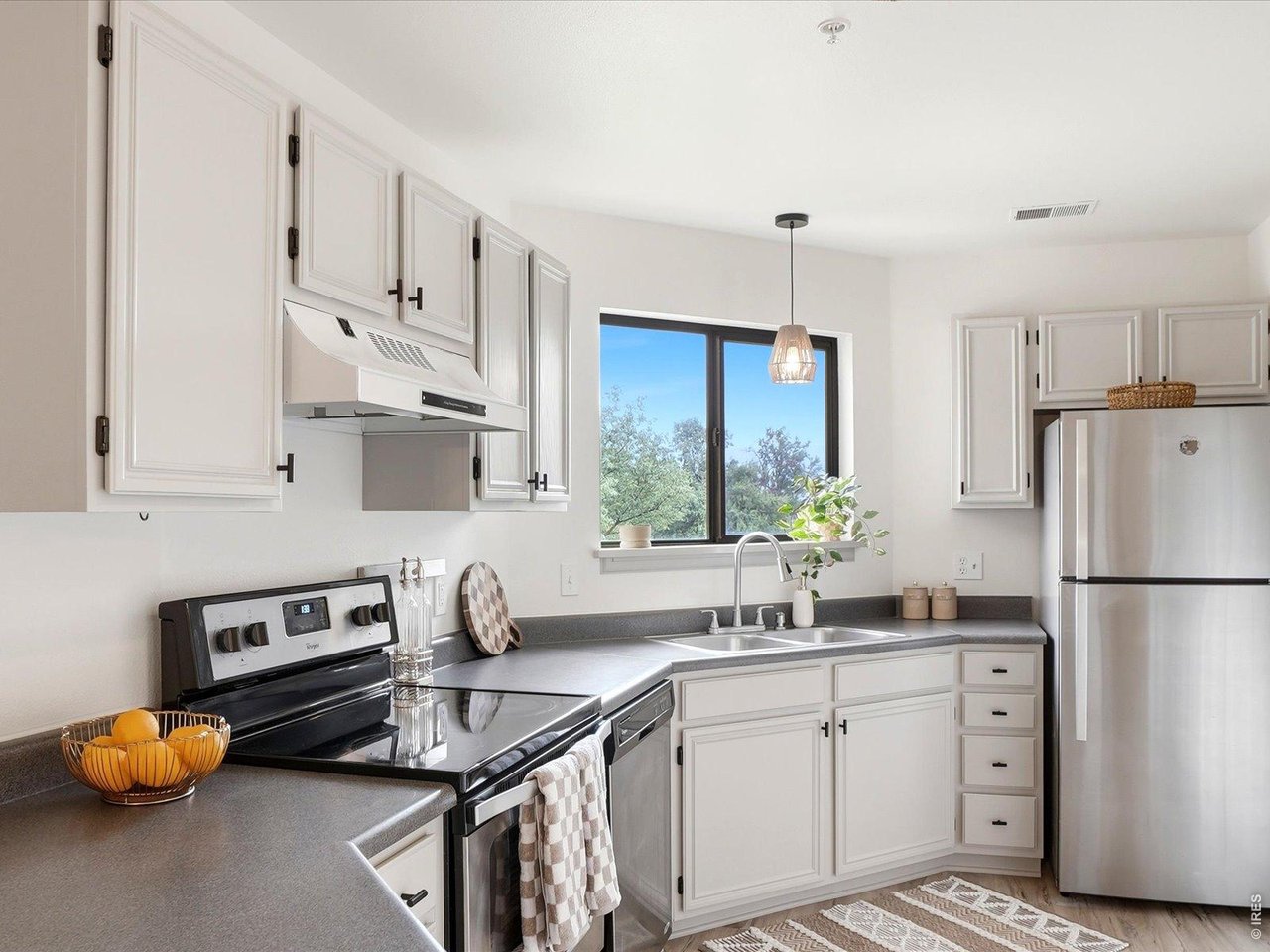 4945 Twin Lakes Road, Unit 46 Boulder, CO 80301 - Photo 19 of 42 A bright, functional kitchen that blends style and practicality with an easy flow to the living and dining areas.